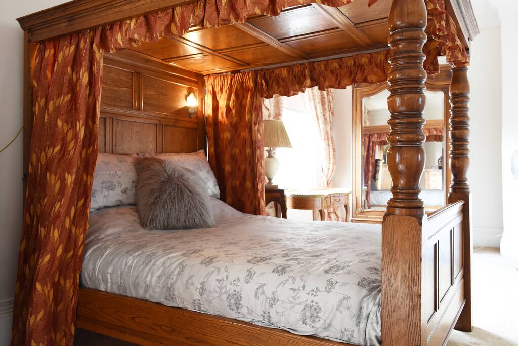 The master bedroom with a kingsize bed situated on the 1st floor of the property.