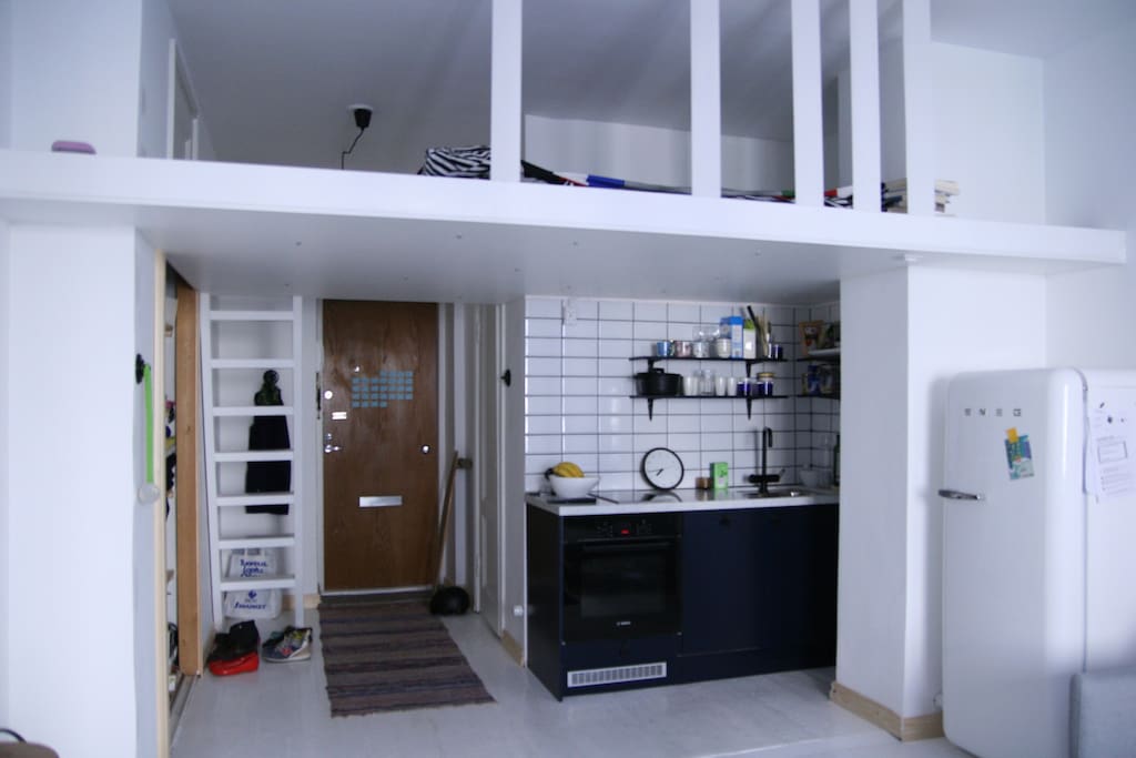 Stairs lead to the loft bed