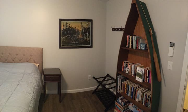 The second queen bedroom features books and games for all ages.

Now you may be asking - is a boat-shaped bookshelf the most functionally designed storage solution?  Well, no.  But is it pretty sweet? We think so.