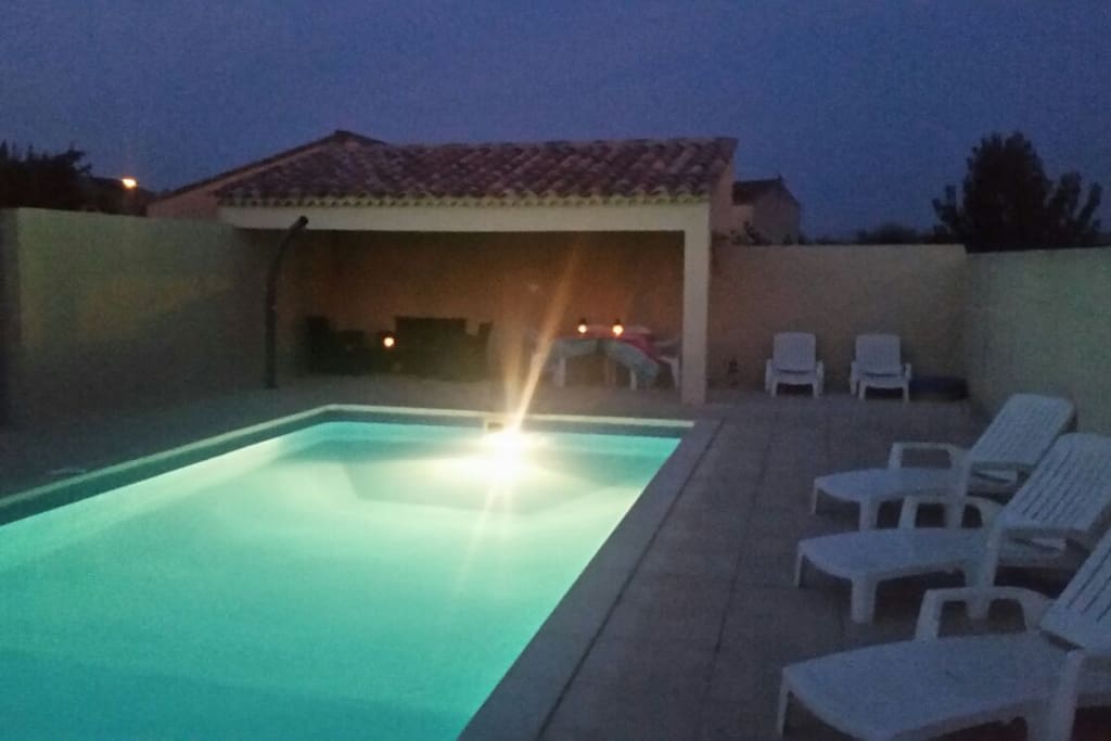 Pool lit for a night time swim.