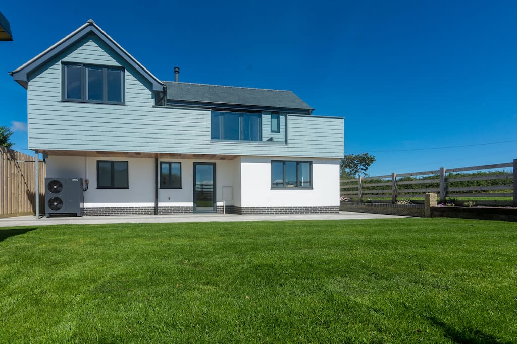 South facing garden backing onto fields and the Cornish countryside.