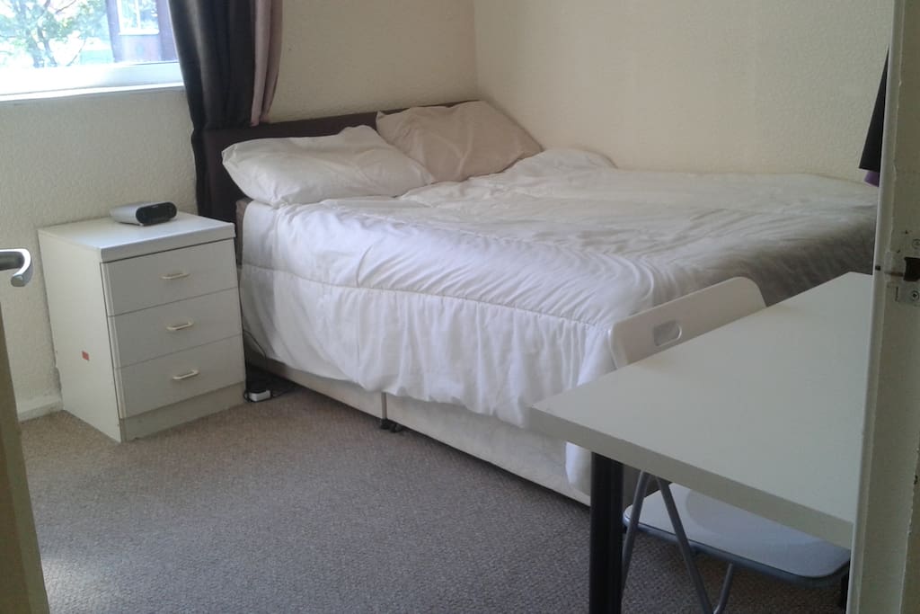 Your bedroom. It has a desk to work from and a wardrobe to hanging your clothes.