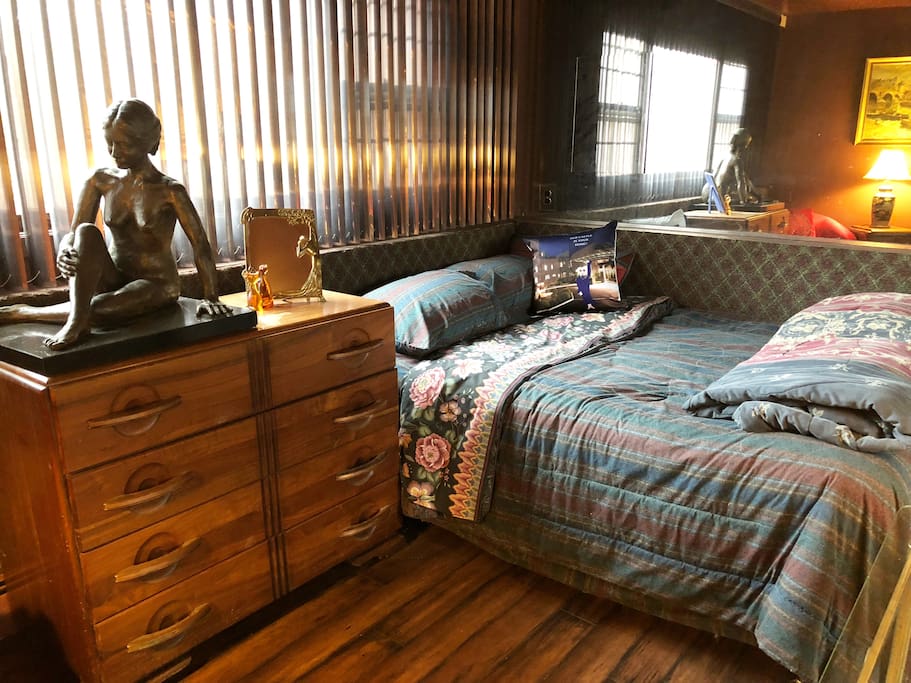 Private Bedroom view 1. Closet, dresser, comfortable chair with lamp for reading.