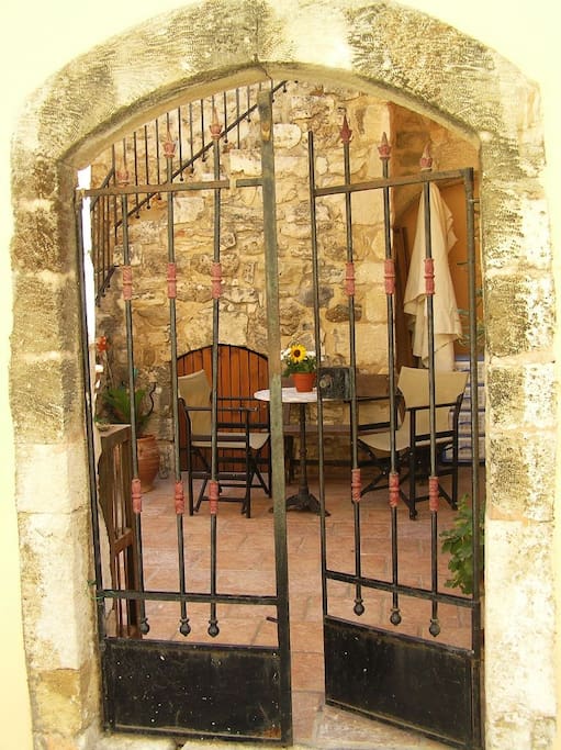 Entrance to the building through a courtyard. Stairs up on the left.