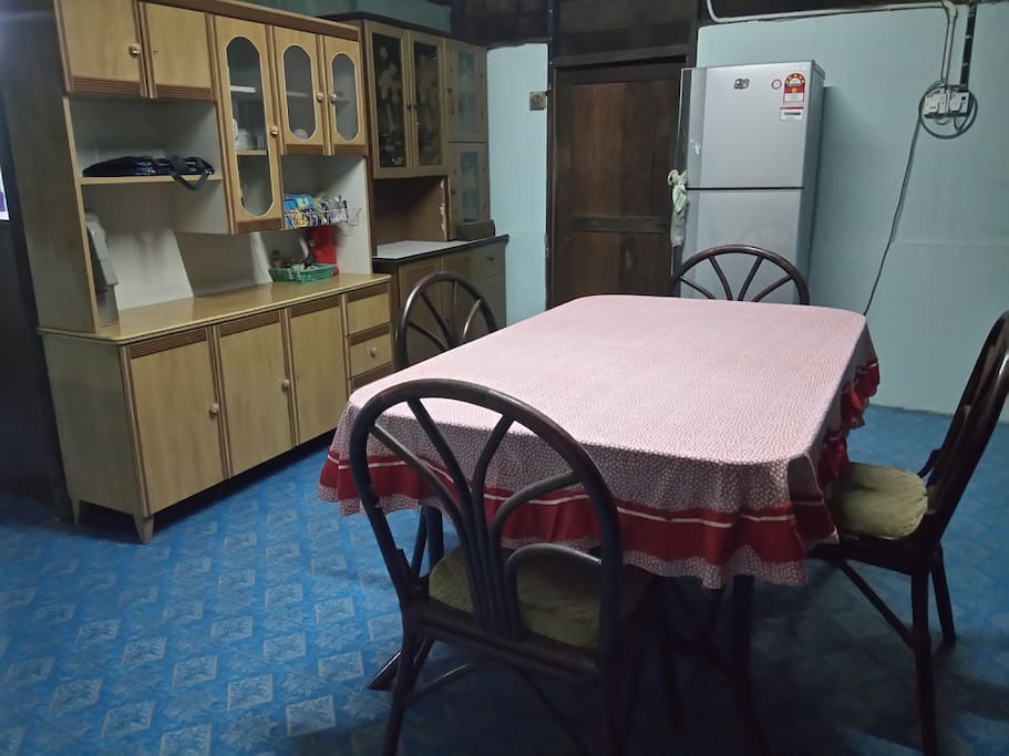 Comfortable dining area equipped with a refrigerator.