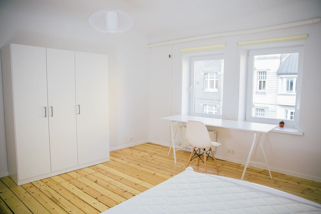 Room 1 with double bed and spacious wardrobe.
