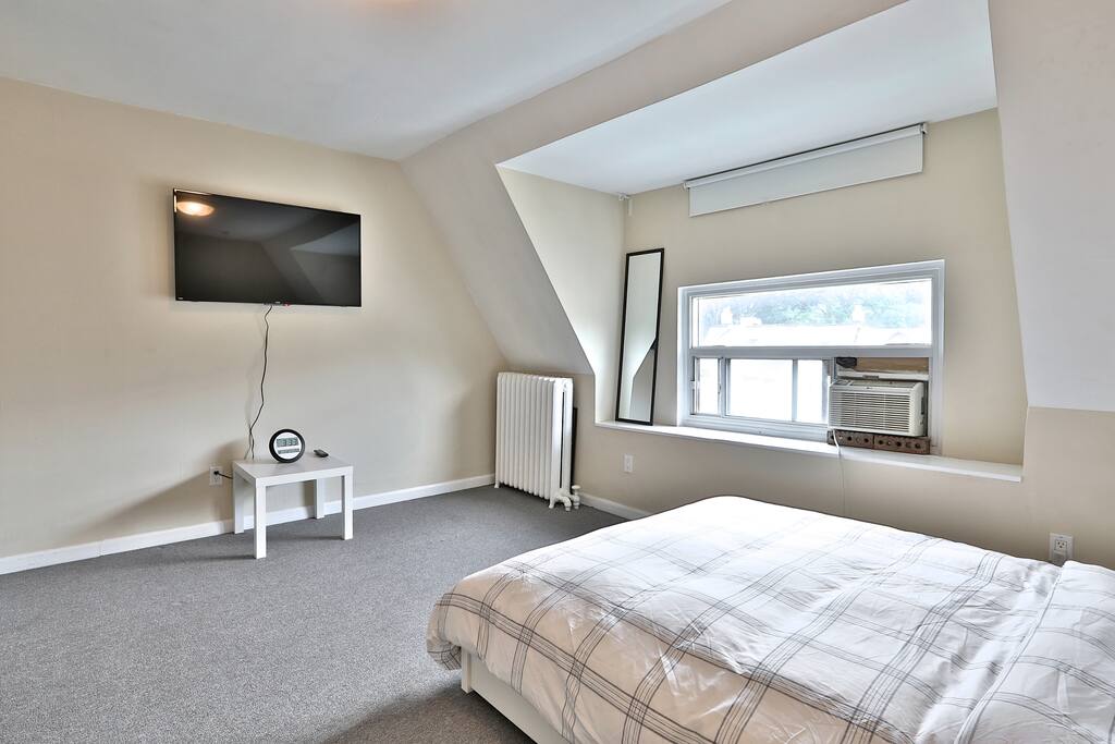 Beautiful Bed with Large Wall Mounted TV