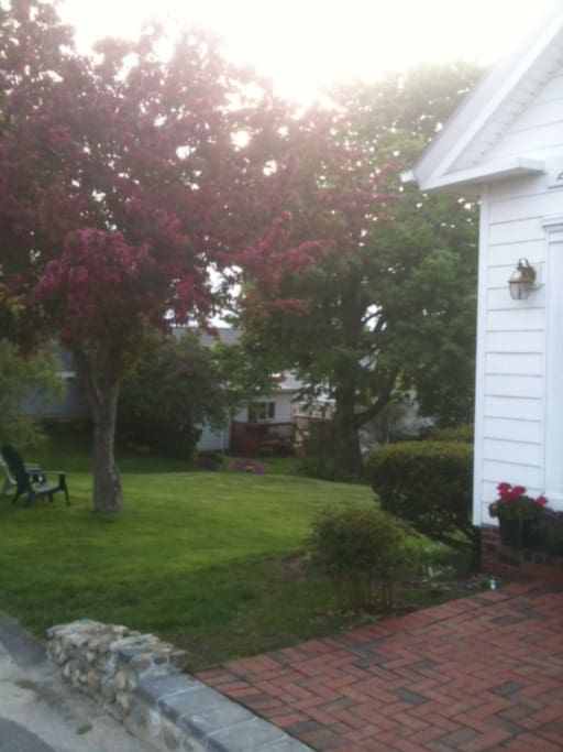 Yard in the spring. Parking available on the side