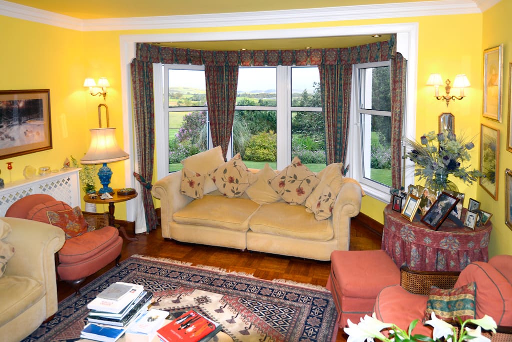 The drawing room with a view of the garden