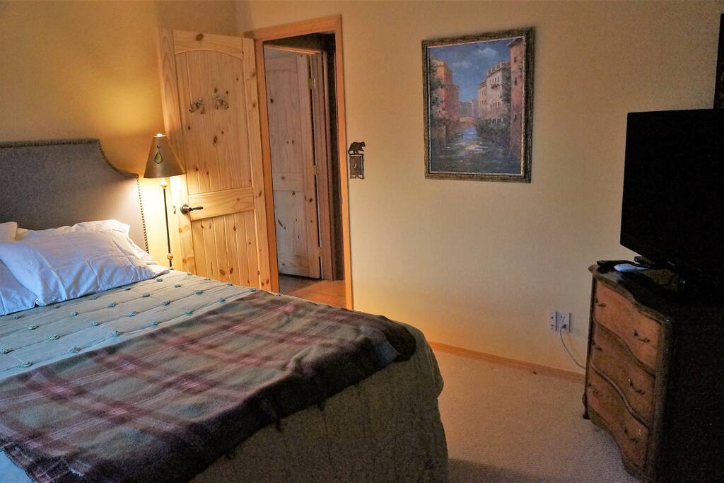 queen size bed with flat screen TV.