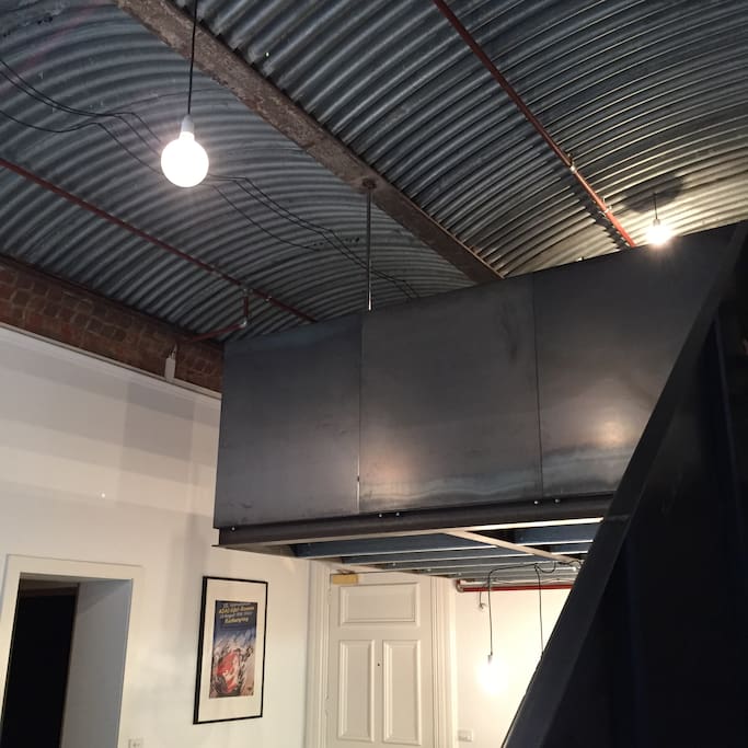 Mezzanine bedroom and high ceilings.