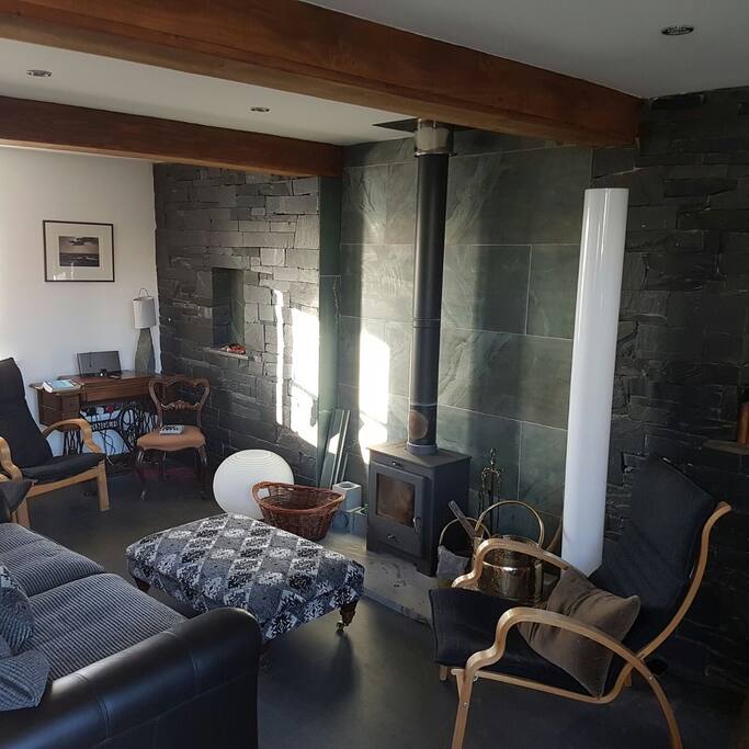 Stove and comfy chairs.