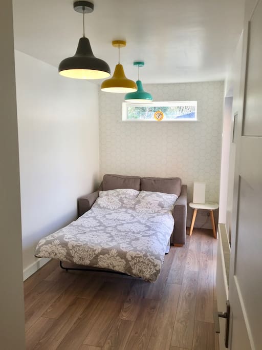 Bedroom with small double sofa bed