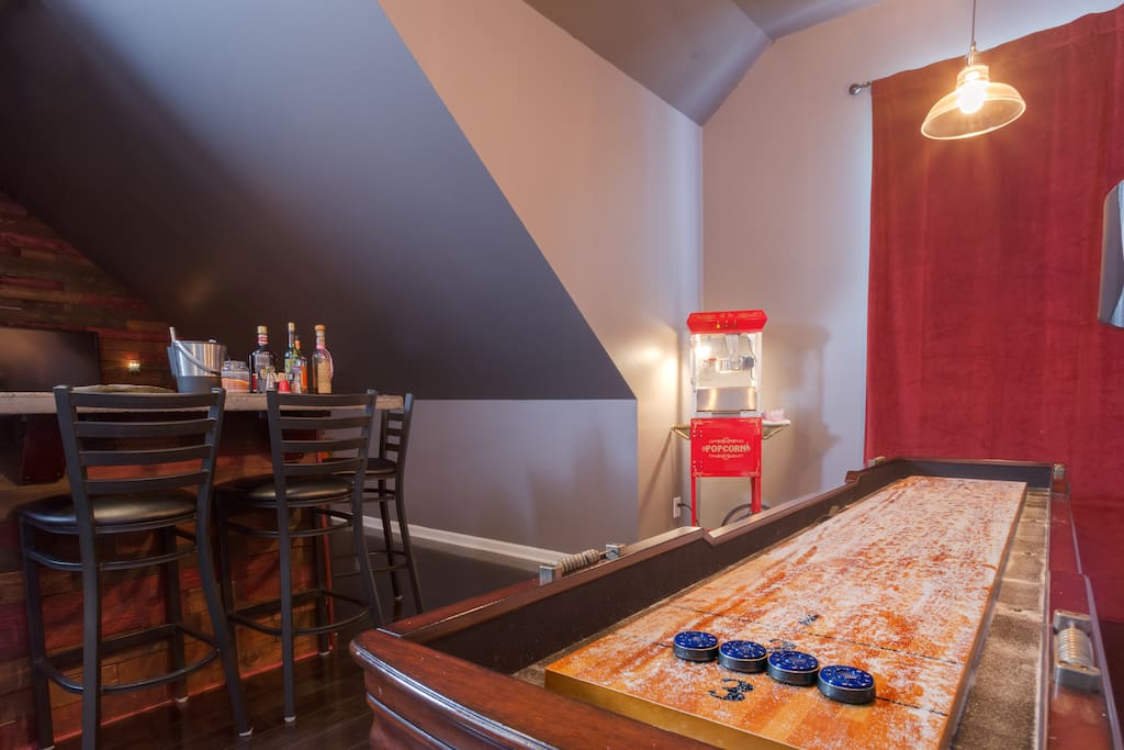 Private Theatre/Bonus Room & Pub - shuffleboard, popcorn machine and bar seating for four with view of tv