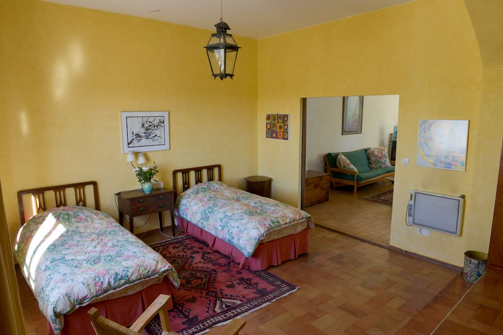 Bedroom with living room behind