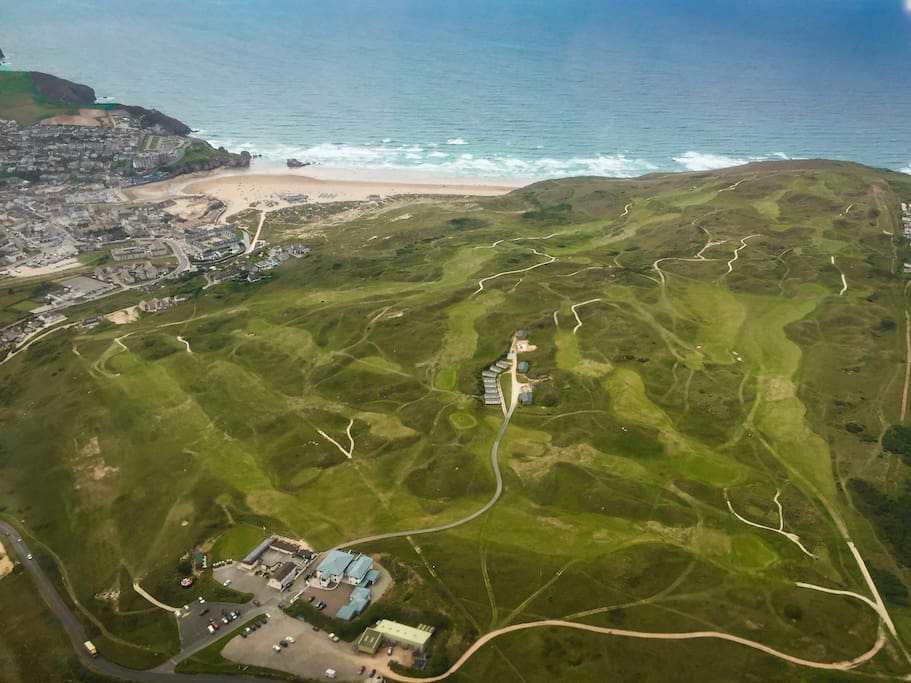 Aerial photos of golf course with accommodation secluded in the middle