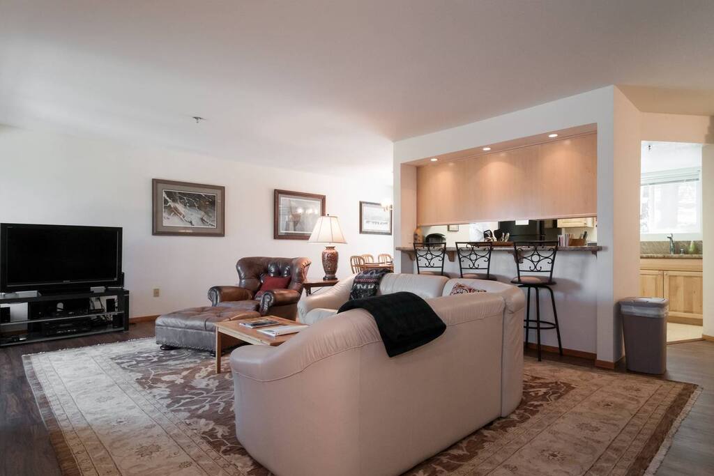 View from living room with bar top seating, plenty of room for everyone to hang out