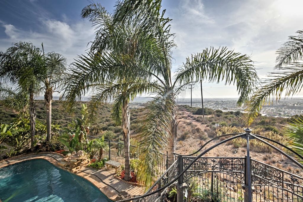 Ideally located near the beach, this home boasts a landscaped yard of fruit trees, flowers, and palm trees.