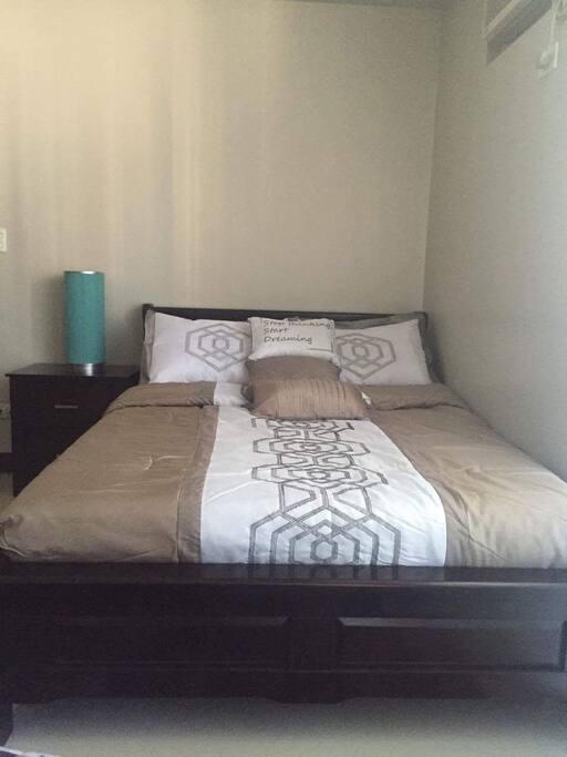 Bed with side table and lamp
