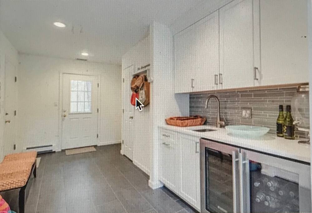 mudroom with wet bar and easy access to backyard pool