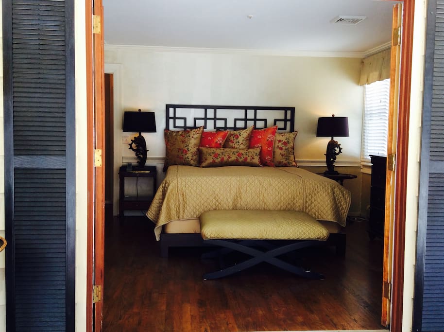 Master bedroom with kingbed. French doors open onto secure screened porch.