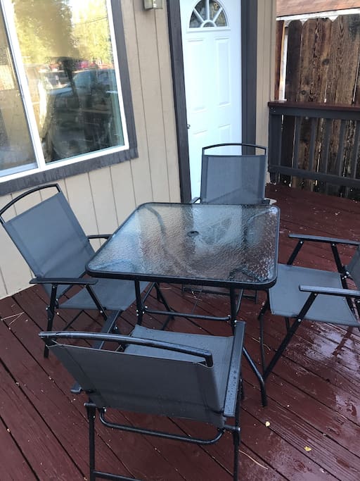 4 patio chairs and a patio table.