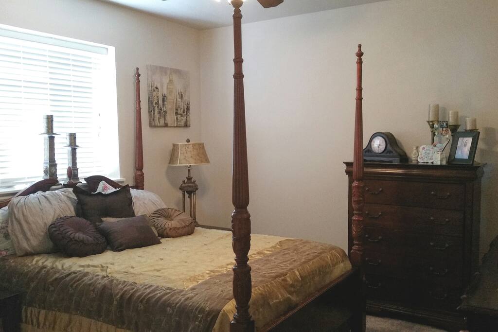 BEAUTIFUL LARGE "GOLD ROOM", with queen bed (*downstairs bedroom with large mirrored dresser, high boy dresser, and full closet)