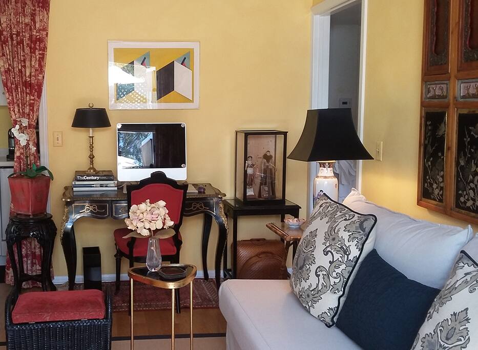 Another view of the sitting room, showing the desk, well suited for writing or computer work.