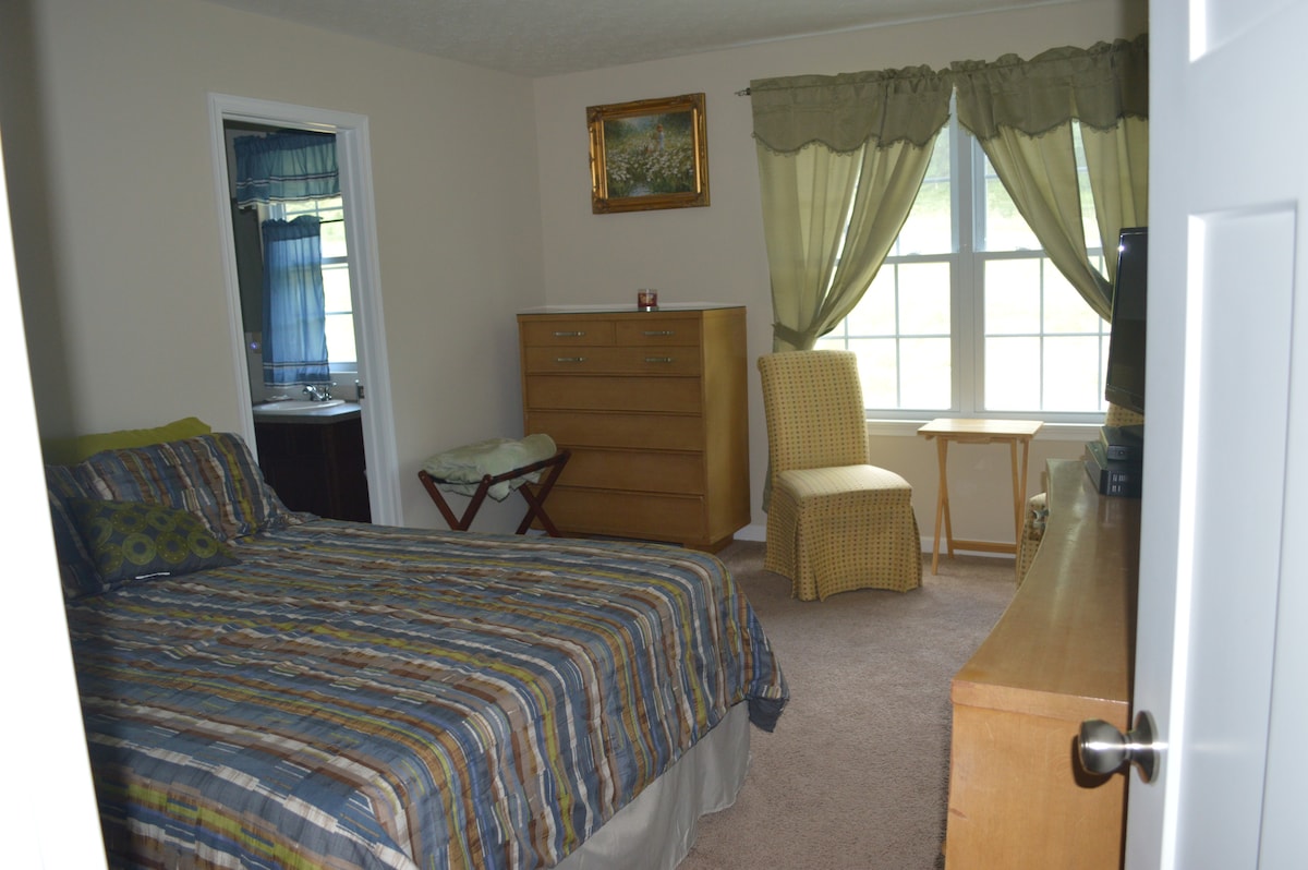 Queen Bed - room for a roll away.
Two chairs to sit and look out the window. 