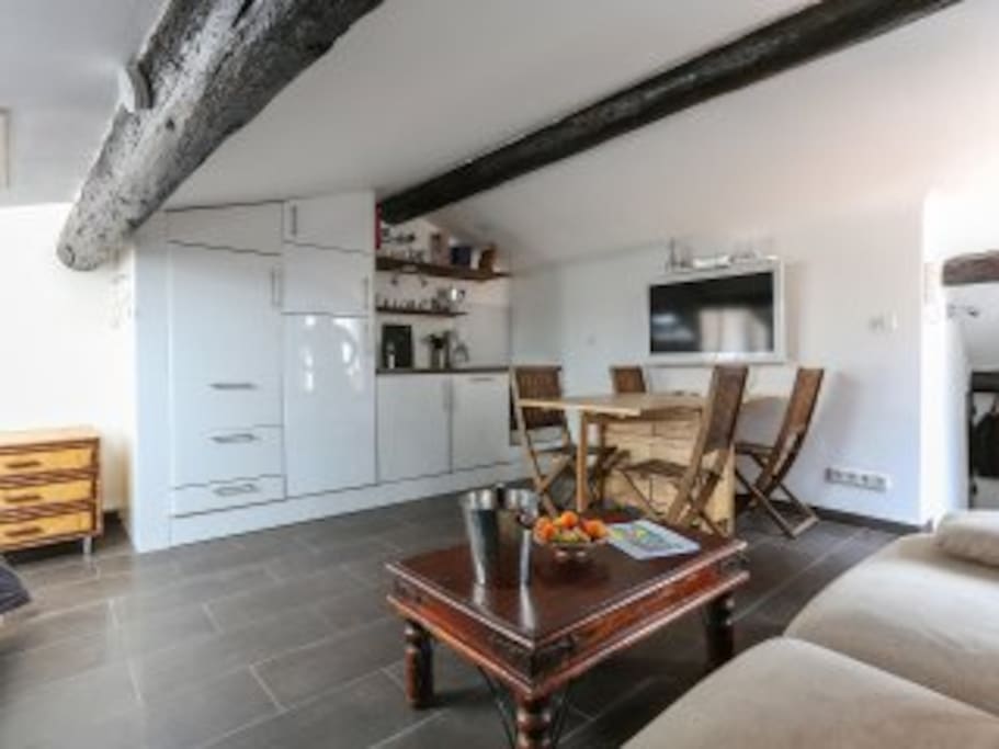 Kitchen and dining table that seats 4 comfortably, 6 max.