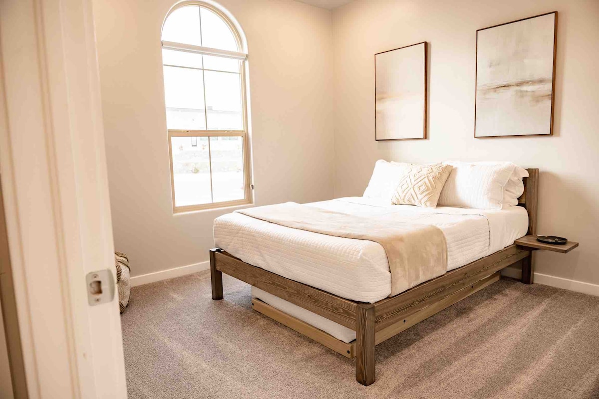 Full shot of one of our rooms with a trundle under the bed