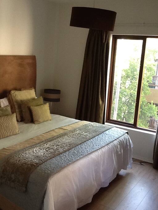 Queen size bed. Morning light. Warm and cozy
