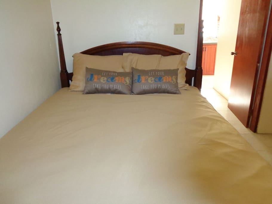 Relax on a Queen Size bed in a fully air conditioned room
