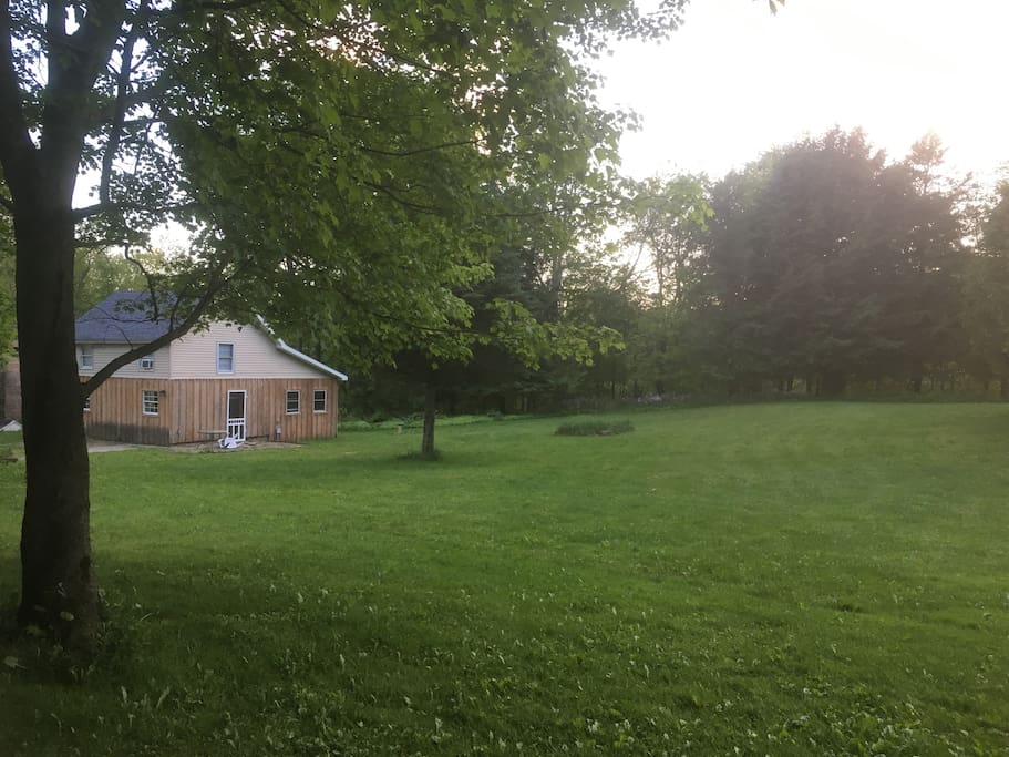 a view of the 1 bedroom cottage from the front yard...Lots of room for a dog to play!
