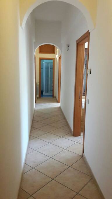 Corridor connecting common areas, bedroom and bathroom