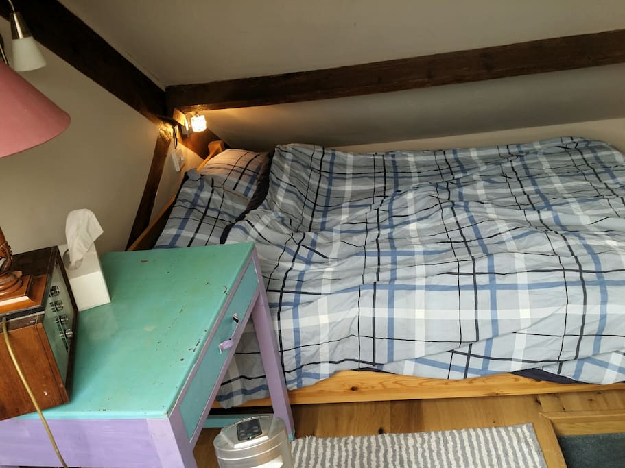 This is the attic double bed with slightly restricted headspace under the eaves on one side of the bed. Note the reading light with dimmer control.
