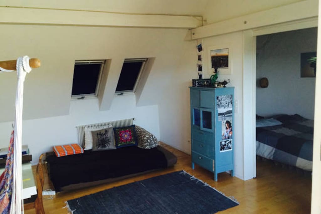 The space (spacious loft area with couch bed and bedroom)