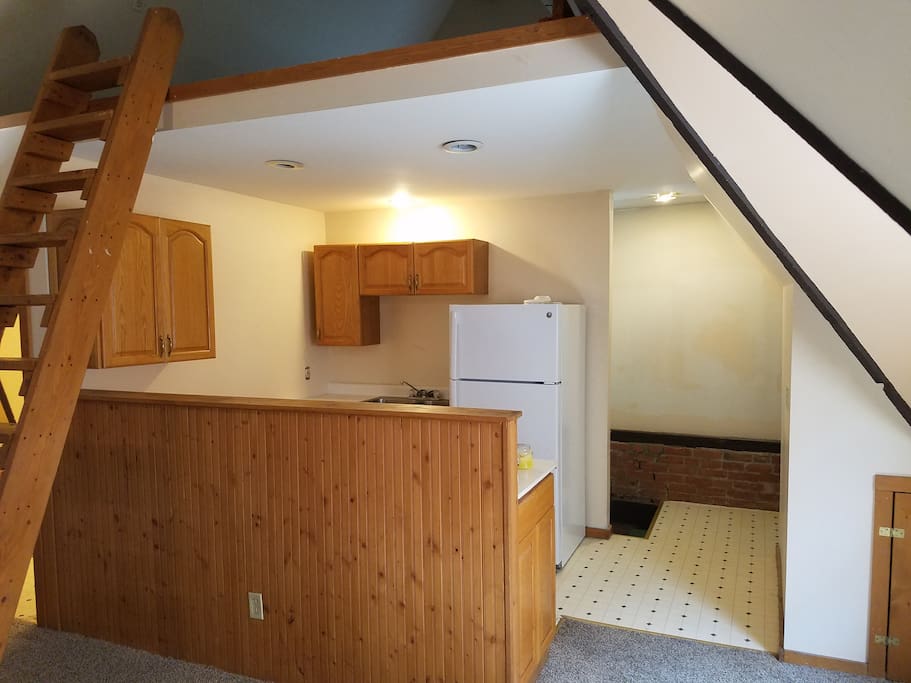 Serving Bar. Top of staircase behind fridge.