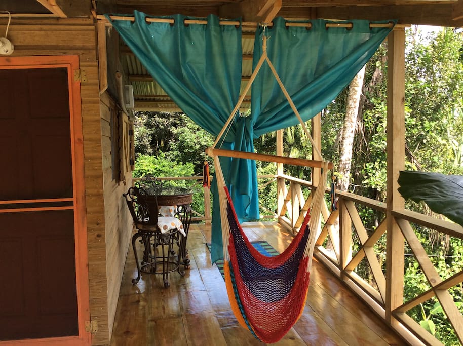 Outdoor sitting area with sitting hammock