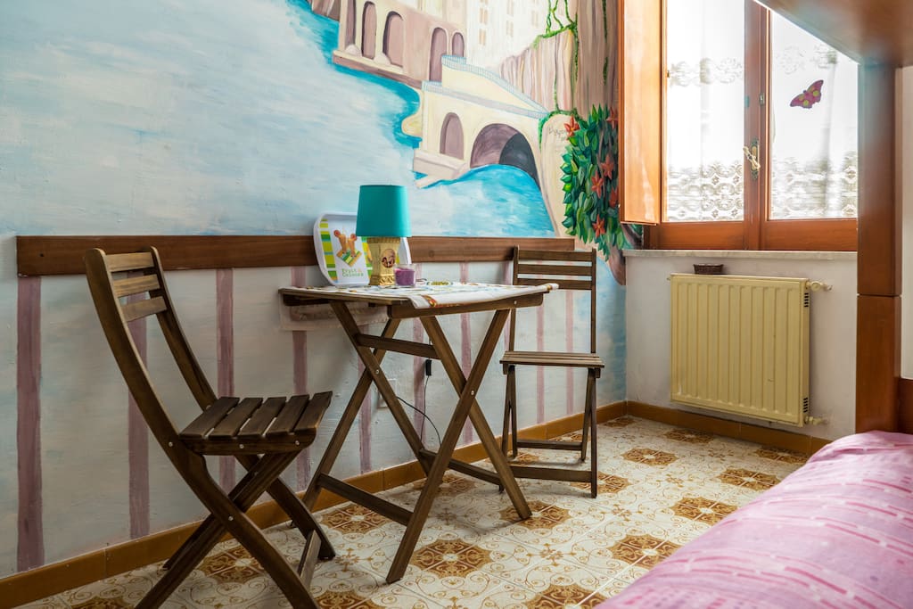 Garden chairs and table in a room