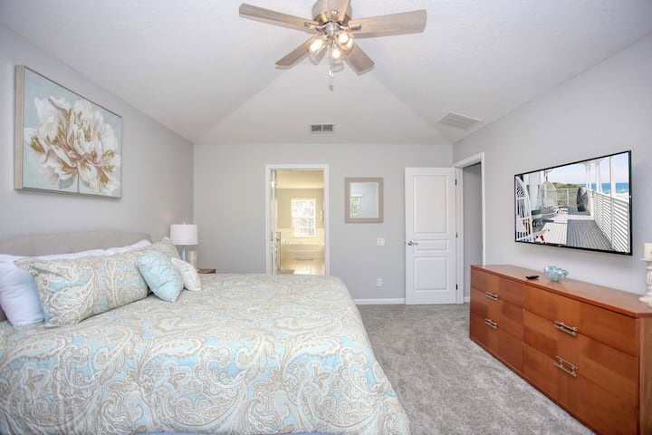 Completely transformed master suite with king bed overlooking the pool deck!