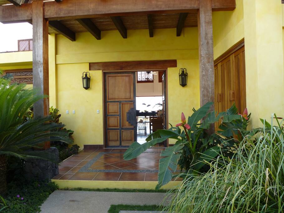Entrance to main house thru lush tropical gardens.