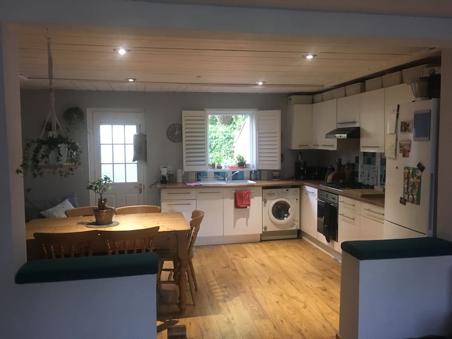 Kitchen with large fridge/freezer, washer/dryer, kettle, toaster, coffee machine