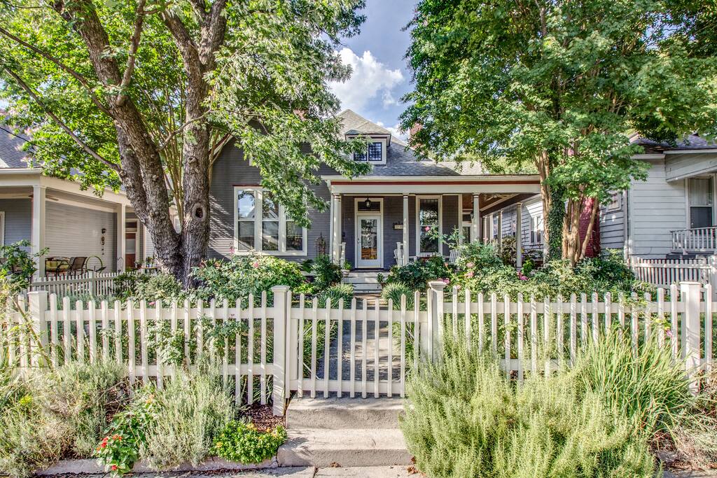 A sweet picket fence welcomes you home.