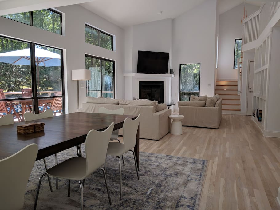 Spacious living dining area with cathedral ceiling
