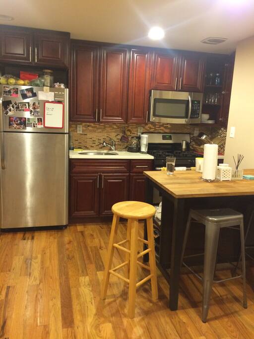 Where the magic happens. Stainless steel appliances, with a ton of cooking utensils.