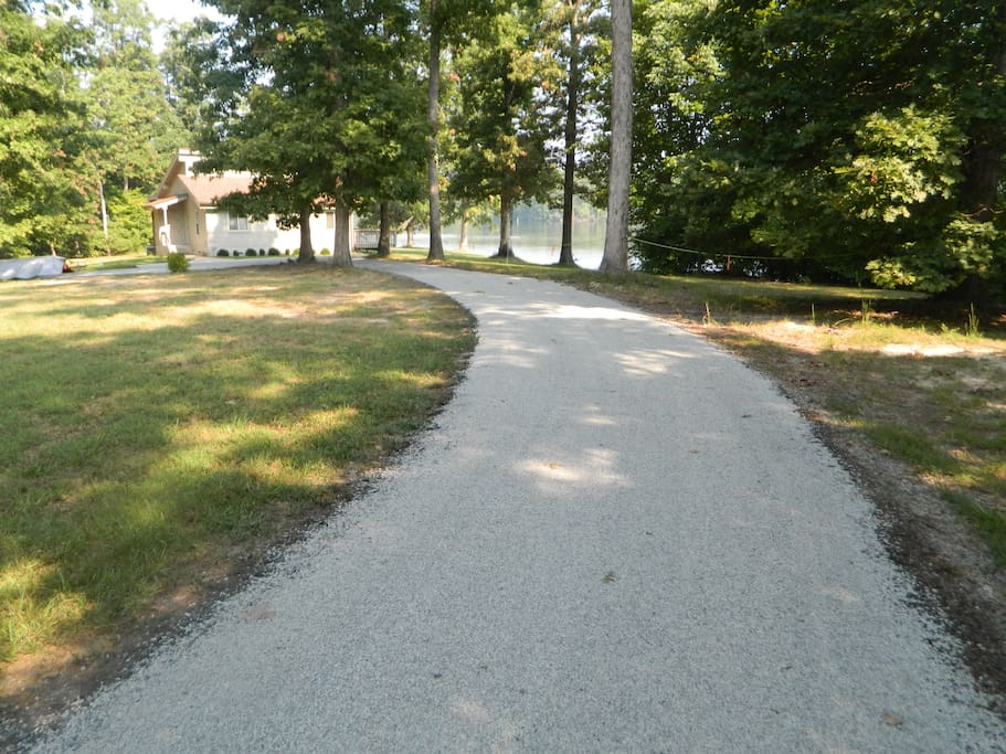 Gravel driveway to house from cul-de-sac