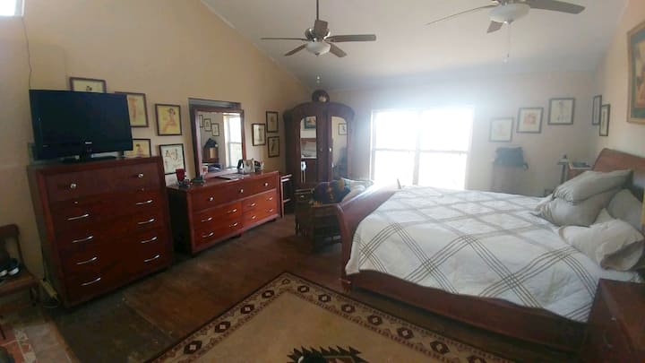 Brand new King size mattress in this HUGE Master bedroom. It is the ONLY bedroom and has the ONLY bathroom which is open to the bedroom, so it is a very quirky set up.