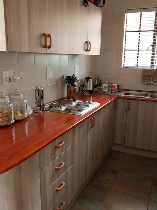 Kitchen with stove, microwave etc