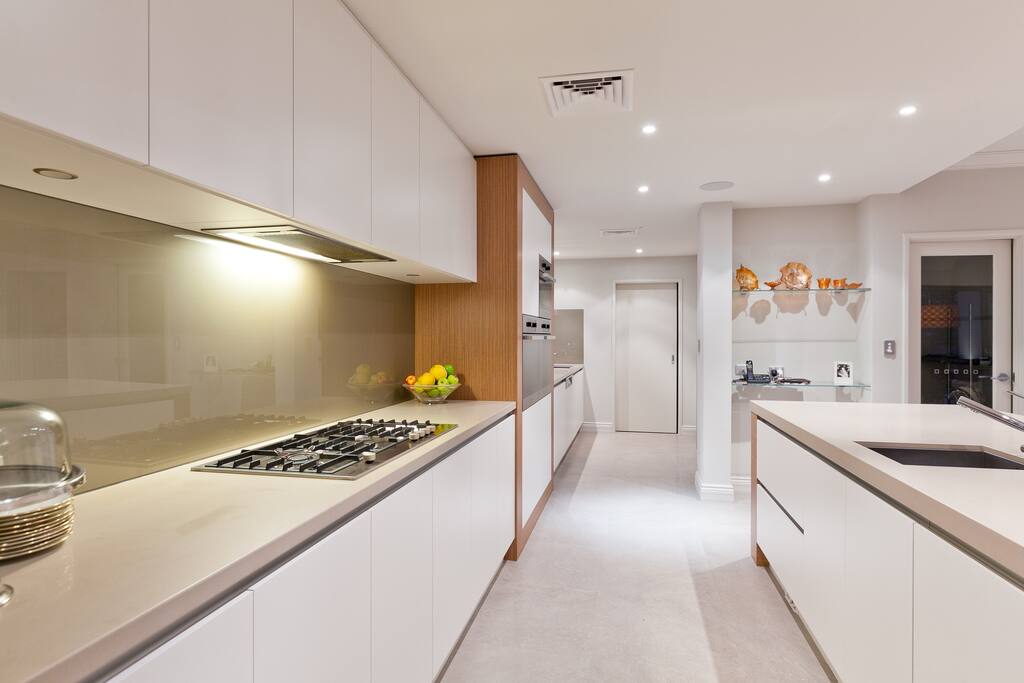 Kitchen and scullery through to laundry